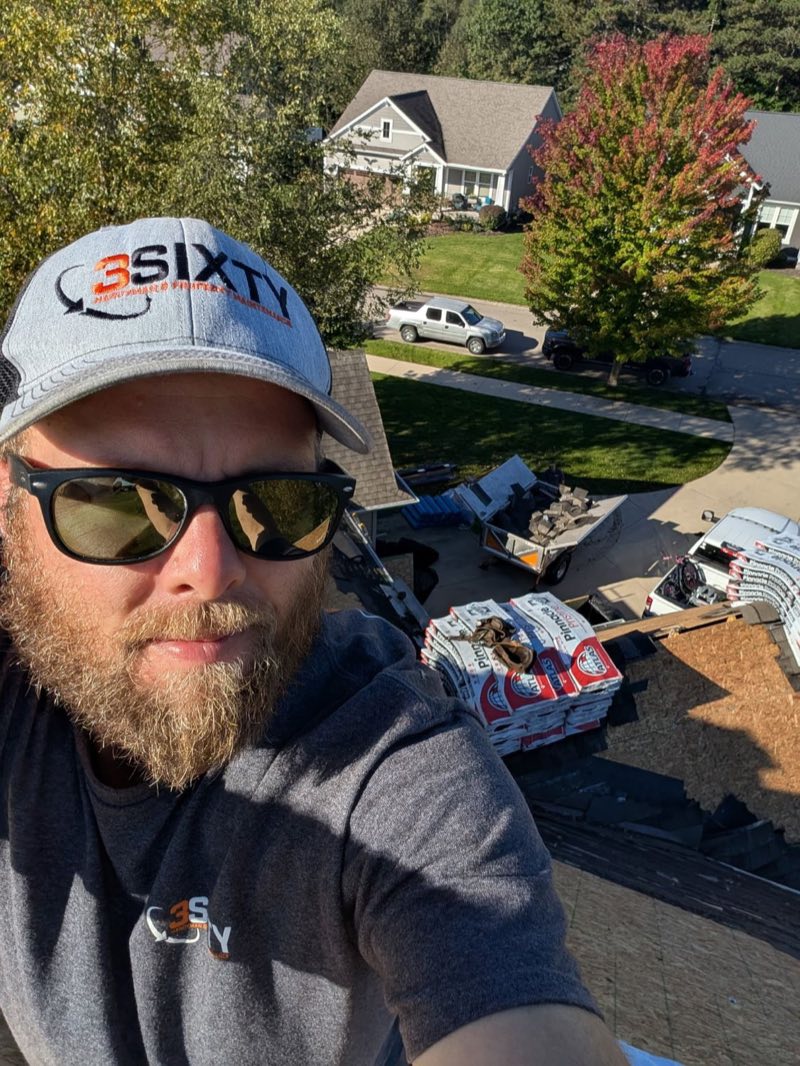 Keith DeHaan, owner of 3Sixty Handyman, on a West Michigan roof during a shingle replacement